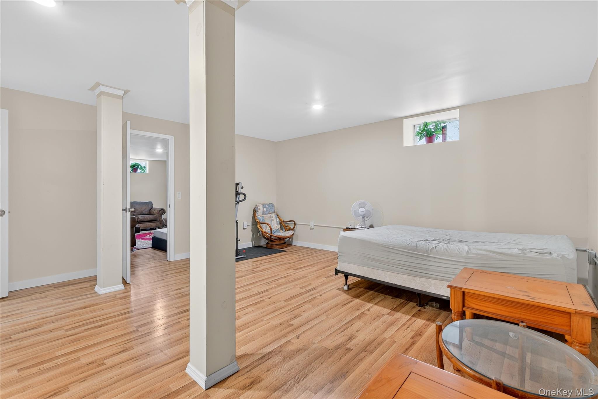 1044 Blue Mountain Road Saugerties, NY 12477 - Photo 26 of 32 a spacious bedroom with a bed and a wooden floor