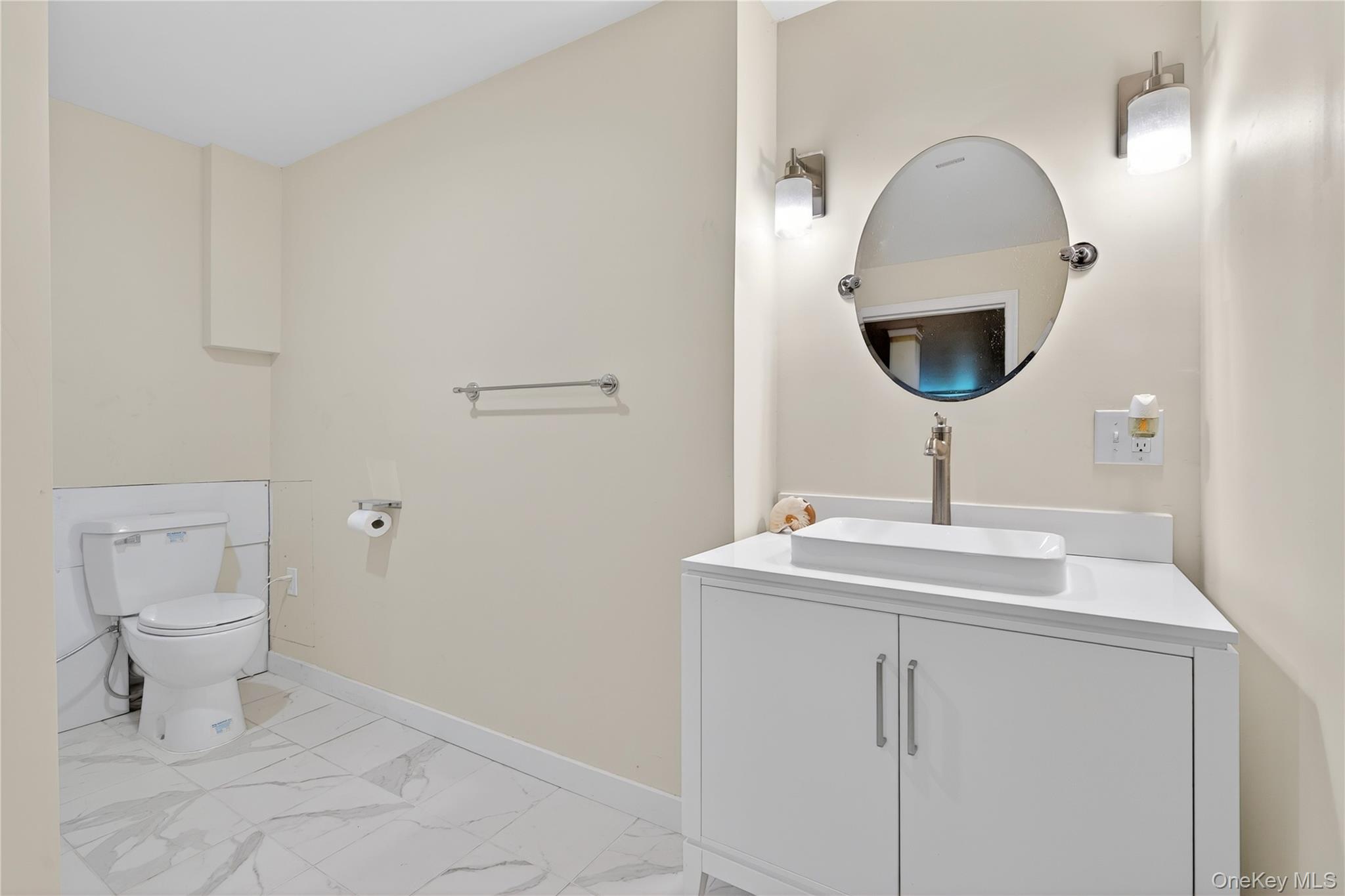 1044 Blue Mountain Road Saugerties, NY 12477 - Photo 27 of 32 a bathroom with a toilet sink and mirror