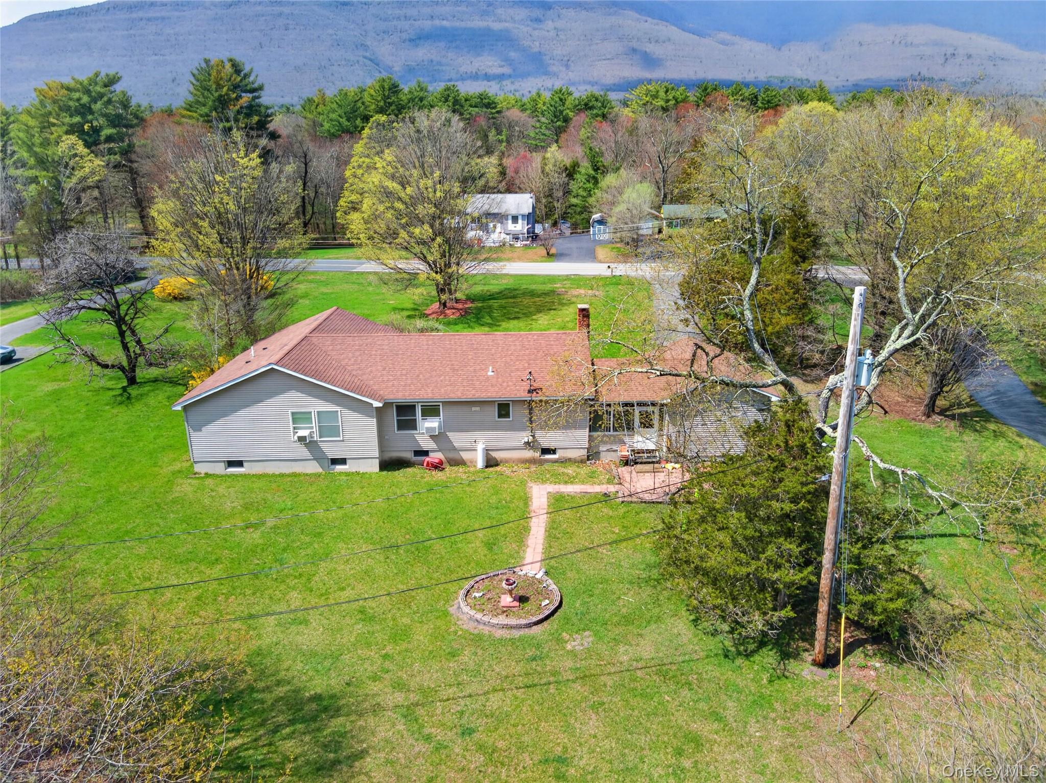 1044 Blue Mountain Road Saugerties, NY 12477 - Photo 29 of 32 a front view of a house with garden