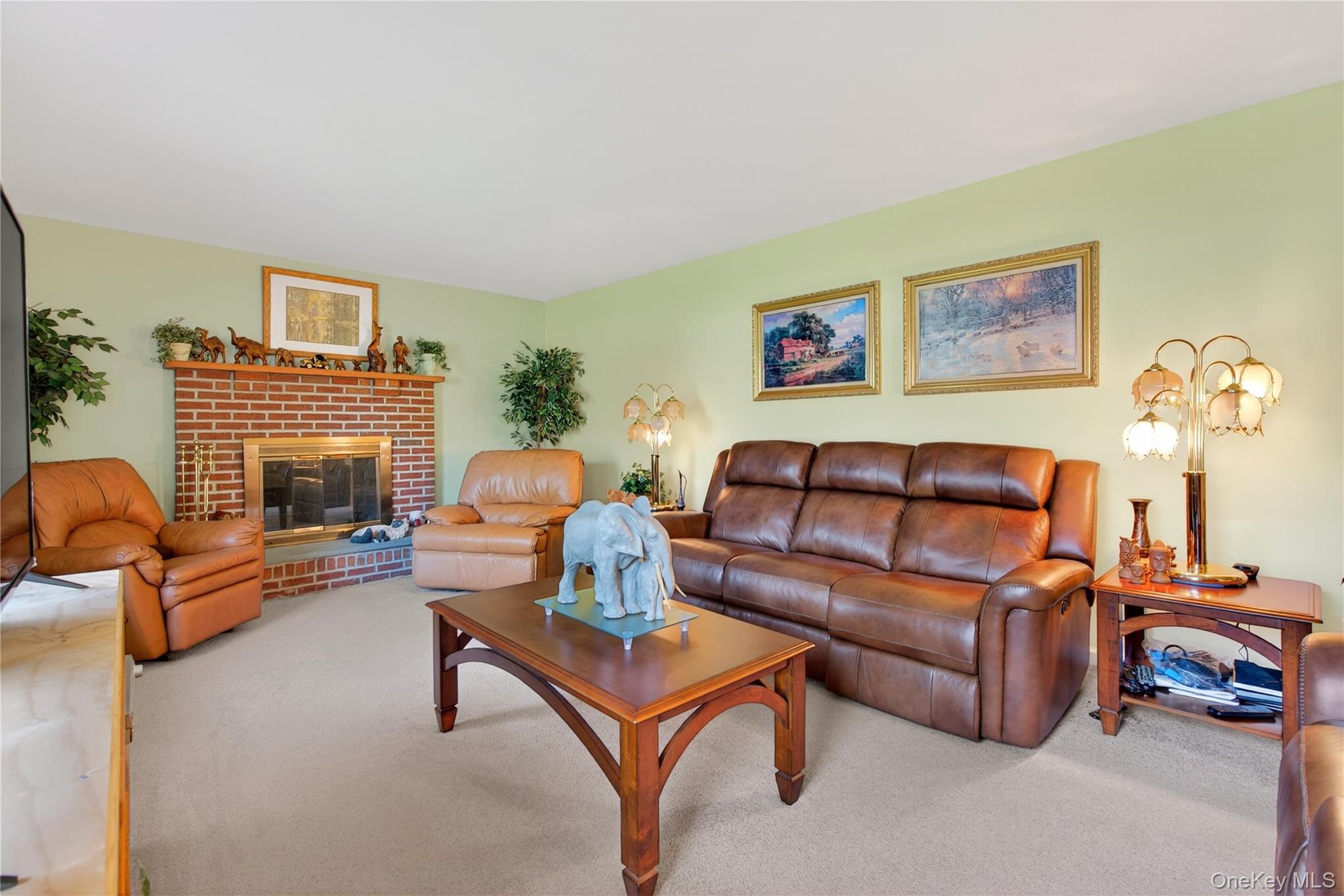 1044 Blue Mountain Road Saugerties, NY 12477 - Photo 3 of 32 a living room with furniture a fireplace and a flat screen tv