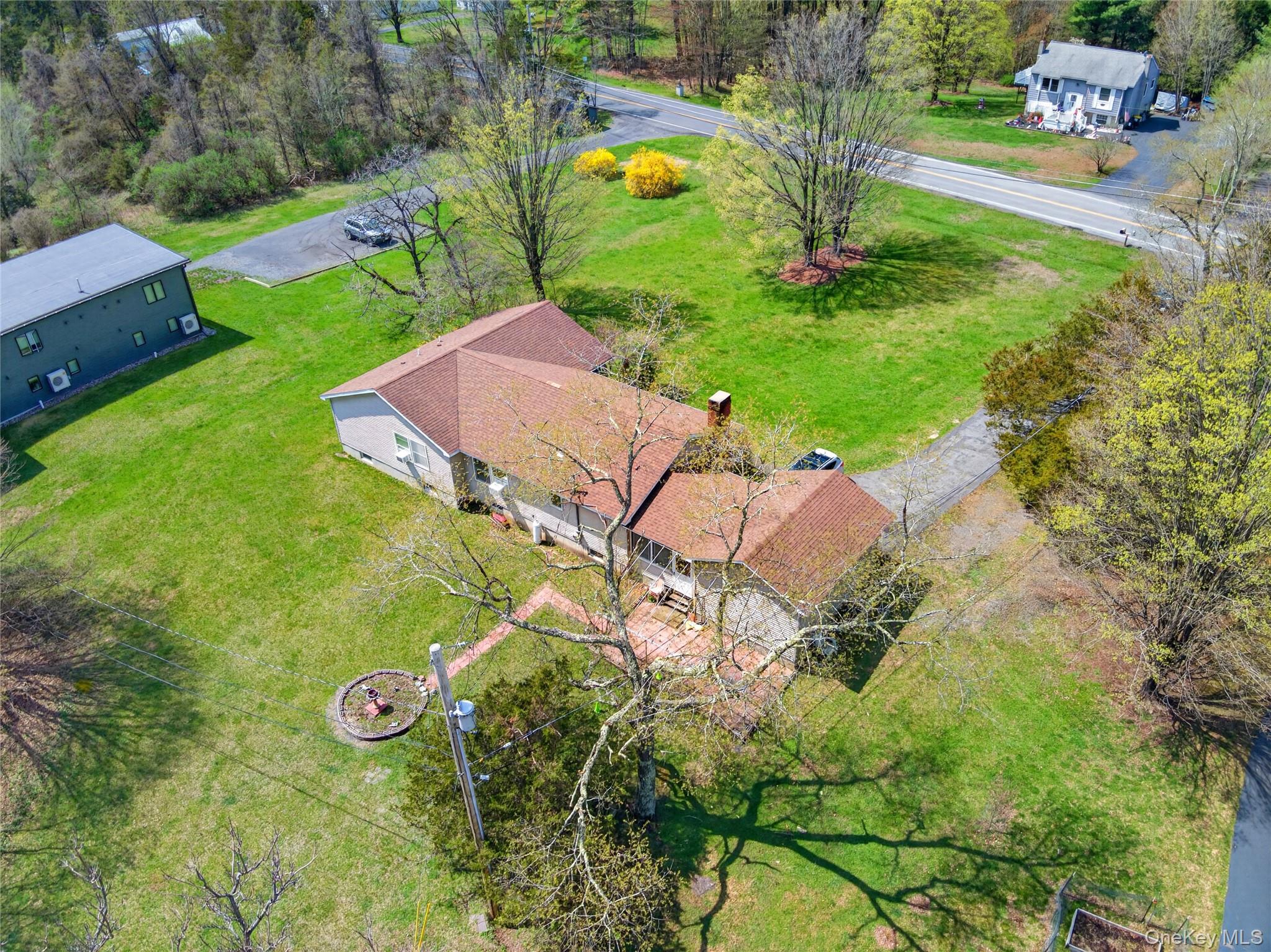 1044 Blue Mountain Road Saugerties, NY 12477 - Photo 32 of 32 an aerial view of residential house with outdoor space and trees all around