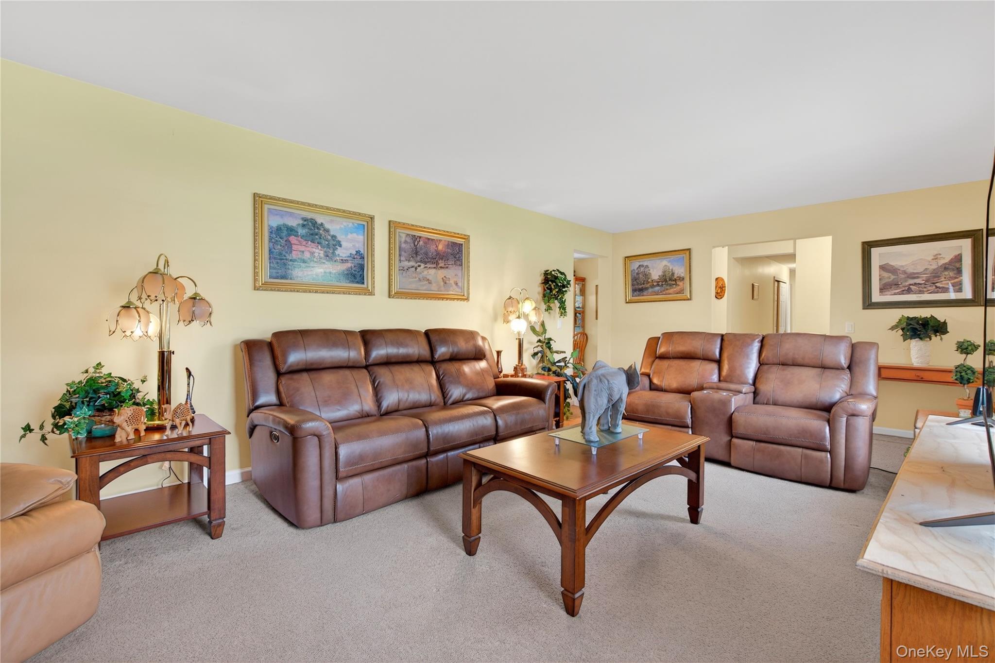 1044 Blue Mountain Road Saugerties, NY 12477 - Photo 4 of 32 a living room with furniture and a potted plant