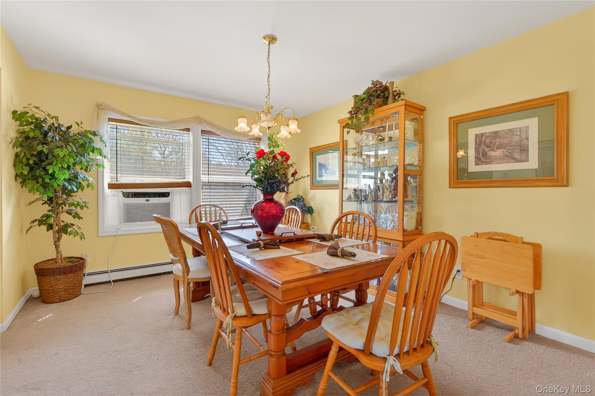 1044 Blue Mountain Road Saugerties, NY 12477 - Photo 8 of 32 a dining room with furniture and a chandelier