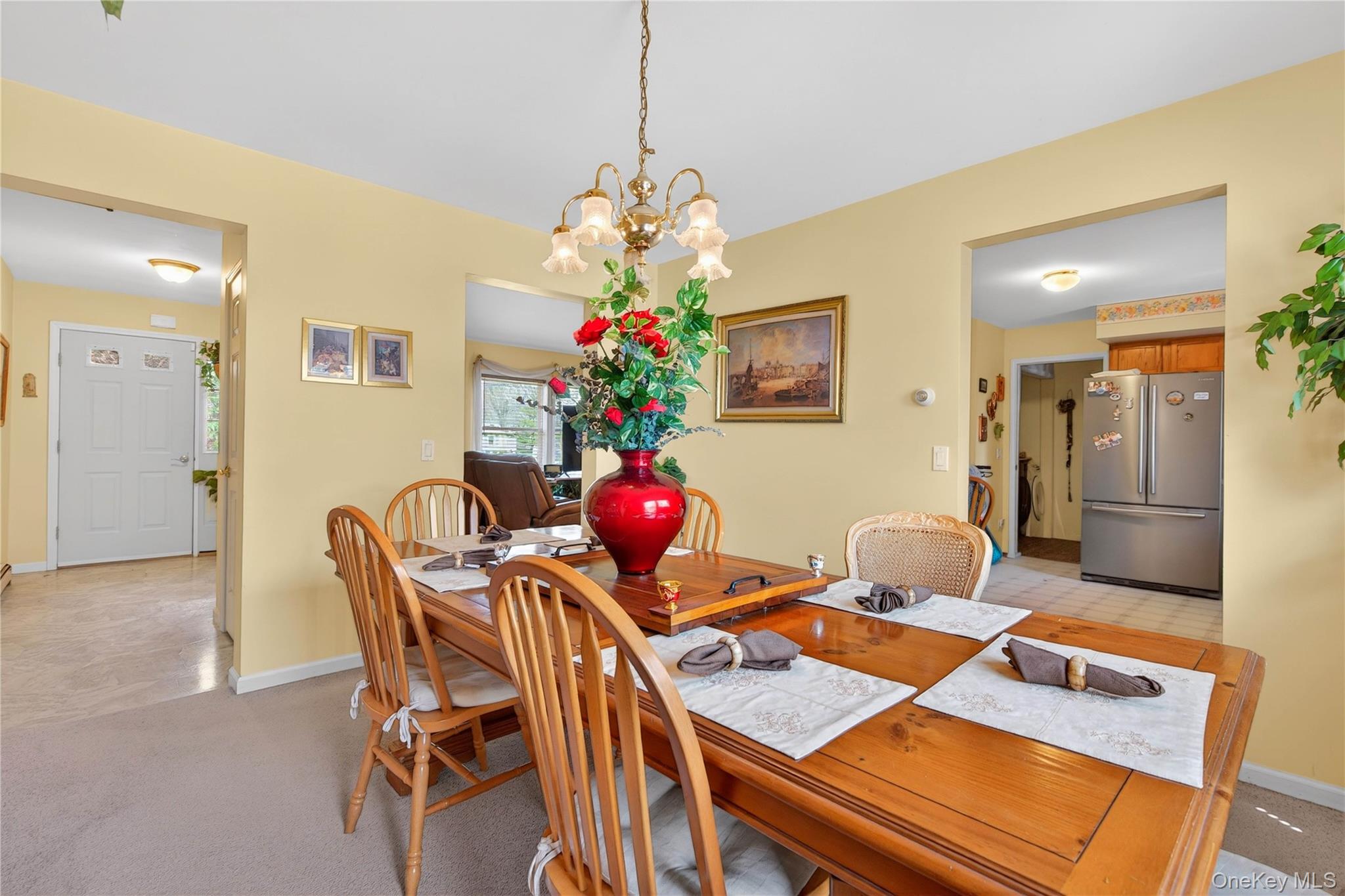 1044 Blue Mountain Road Saugerties, NY 12477 - Photo 9 of 32 a view of a dining room with furniture and a chandelier