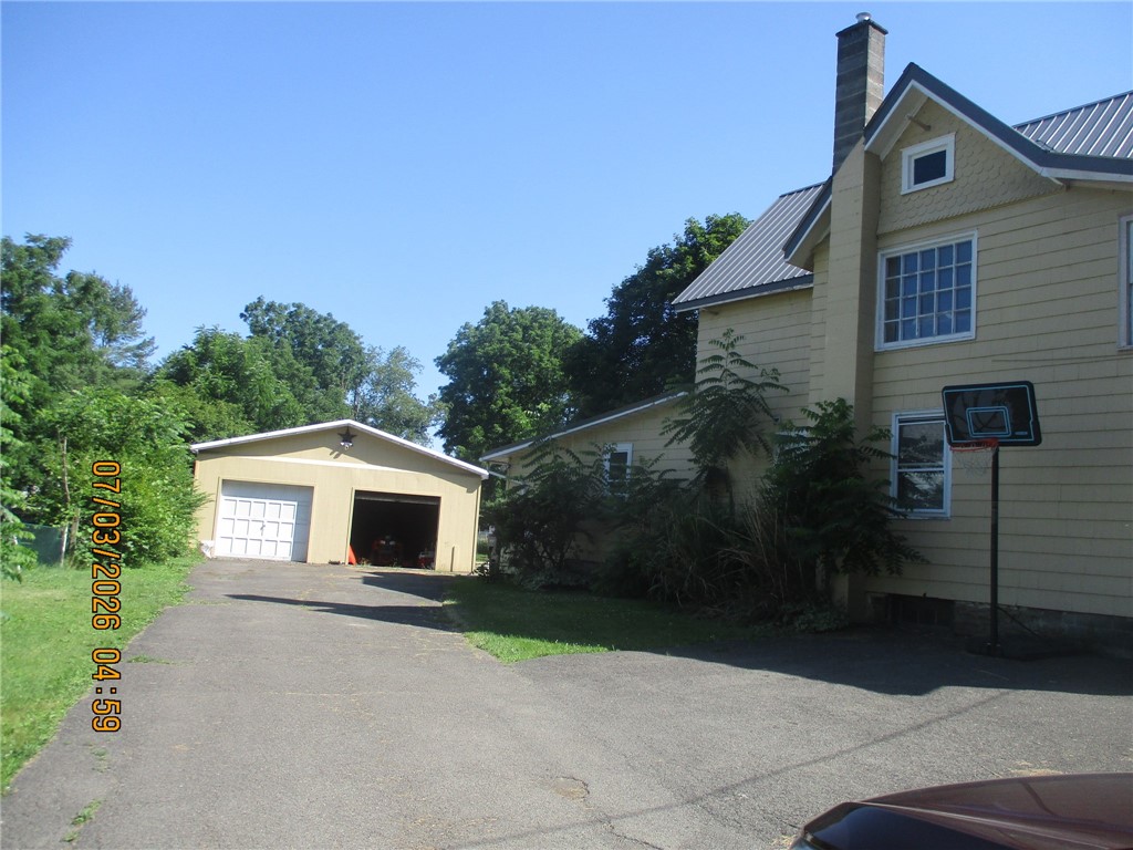 21 Caton Road Corning, NY 14830 - Photo 2 of 4 side and garage