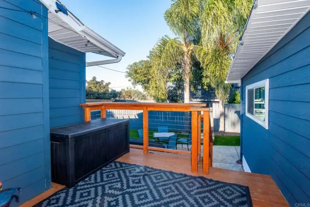 a balcony view with a seating space