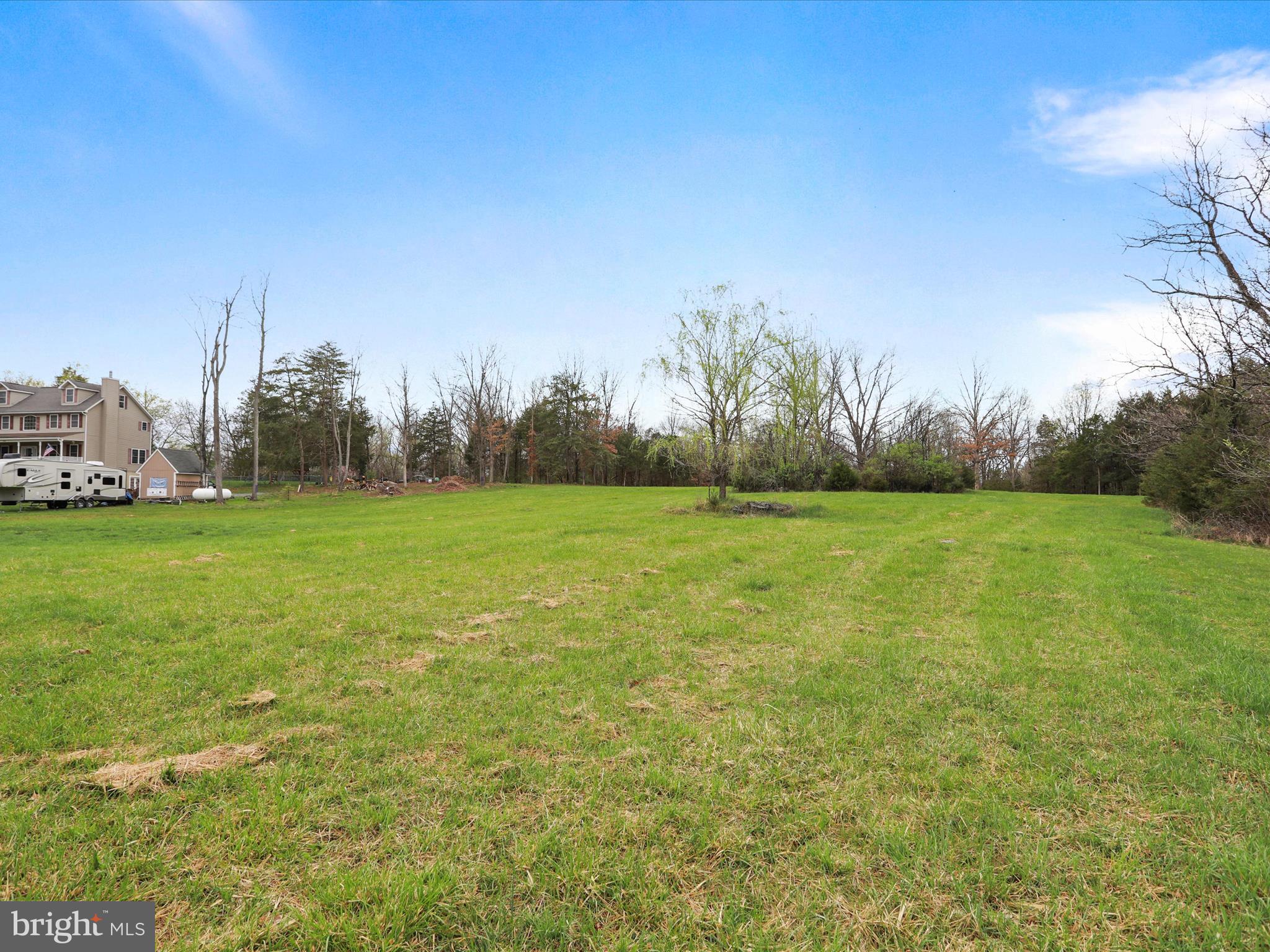 Summit Point Rd Summit Point Summit Point, WV 25446 - Photo 26 of 26 a view of a green field with trees in the background