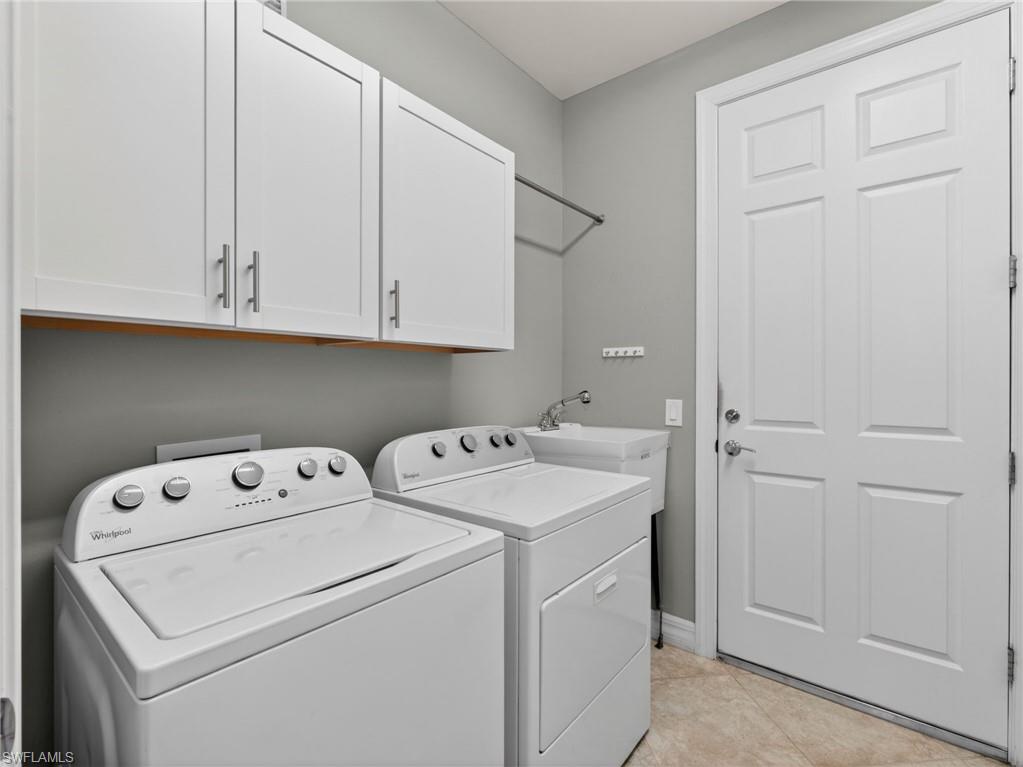 6124 Victory Drive Ave Maria, FL 34142 - Photo 41 of 50 a utility room with dryer and washer