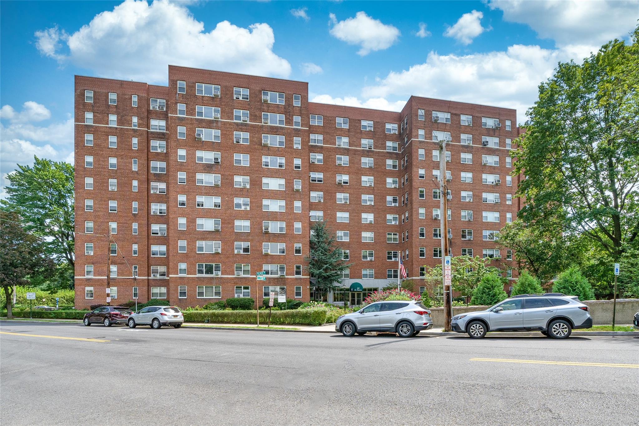 a view of street with parked cars