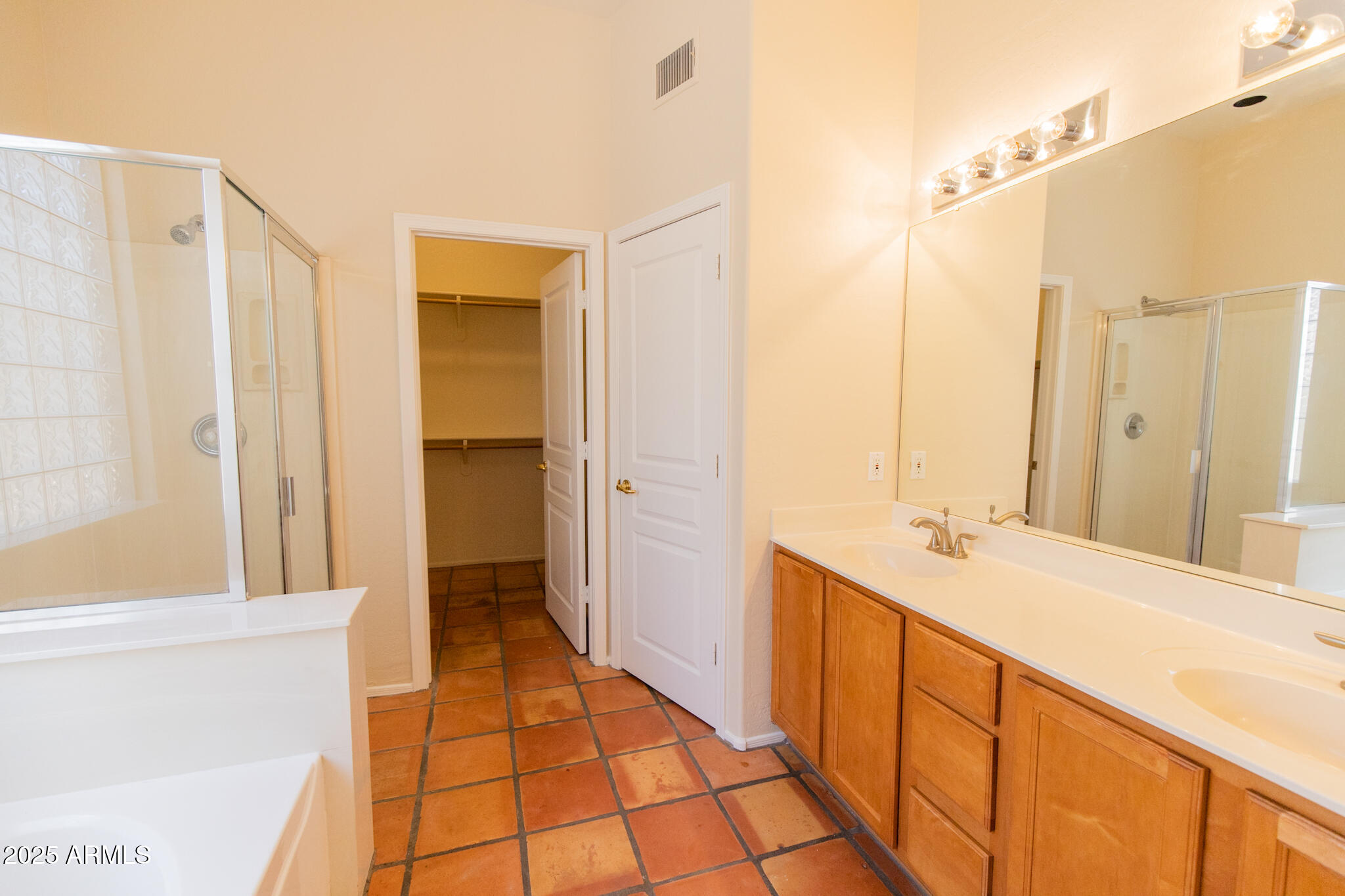 770 West Aloe Place Chandler, AZ 85248 - Photo 14 of 28 a bathroom with a double vanity sink and a mirror