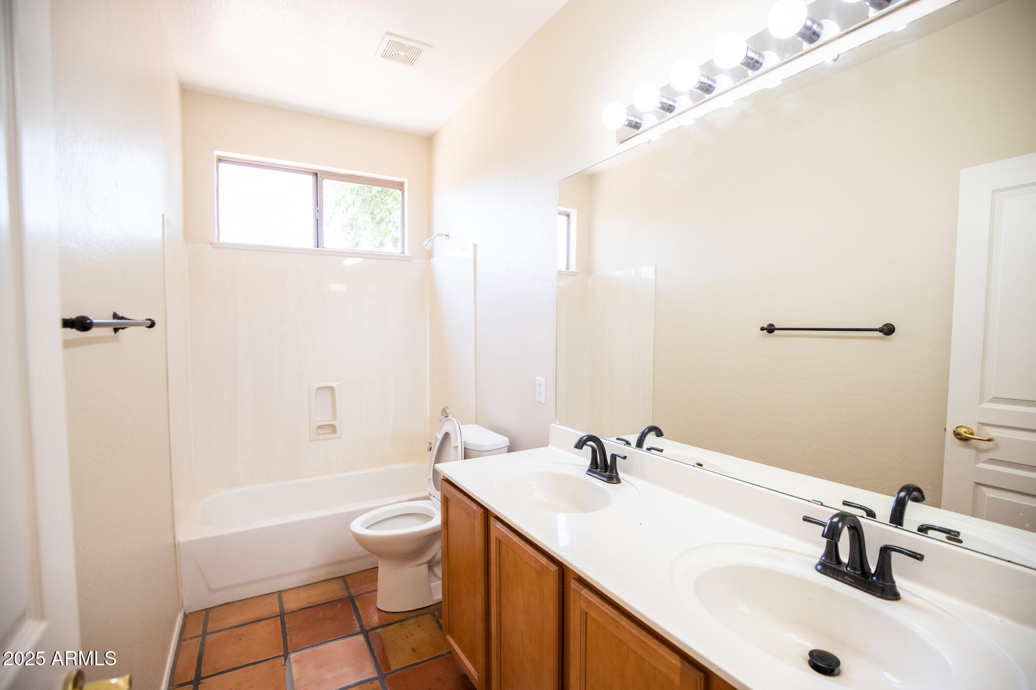 770 West Aloe Place Chandler, AZ 85248 - Photo 21 of 28 a bathroom with a sink a toilet and shower