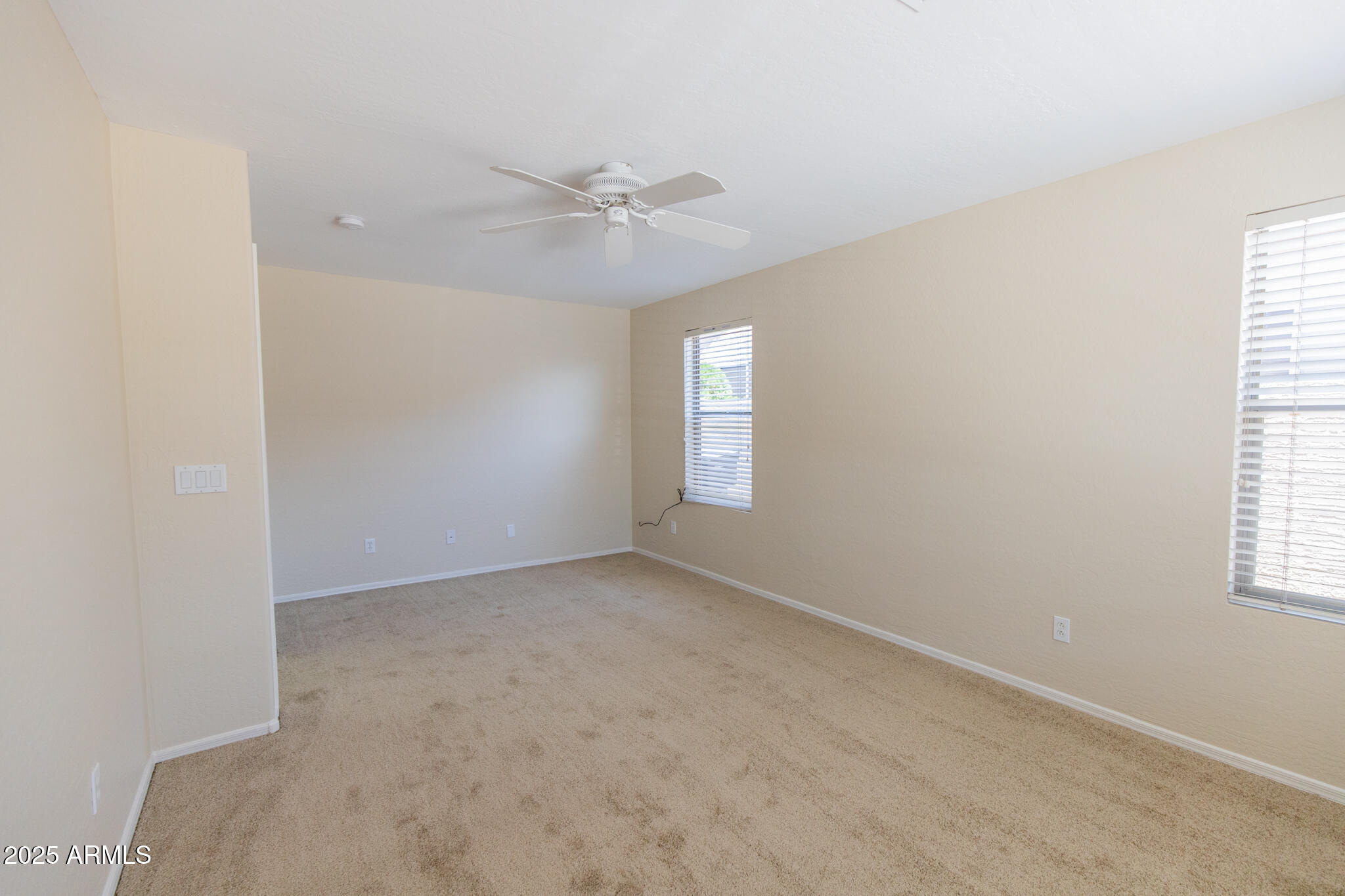 770 West Aloe Place Chandler, AZ 85248 - Photo 24 of 28 an empty room with windows and fan