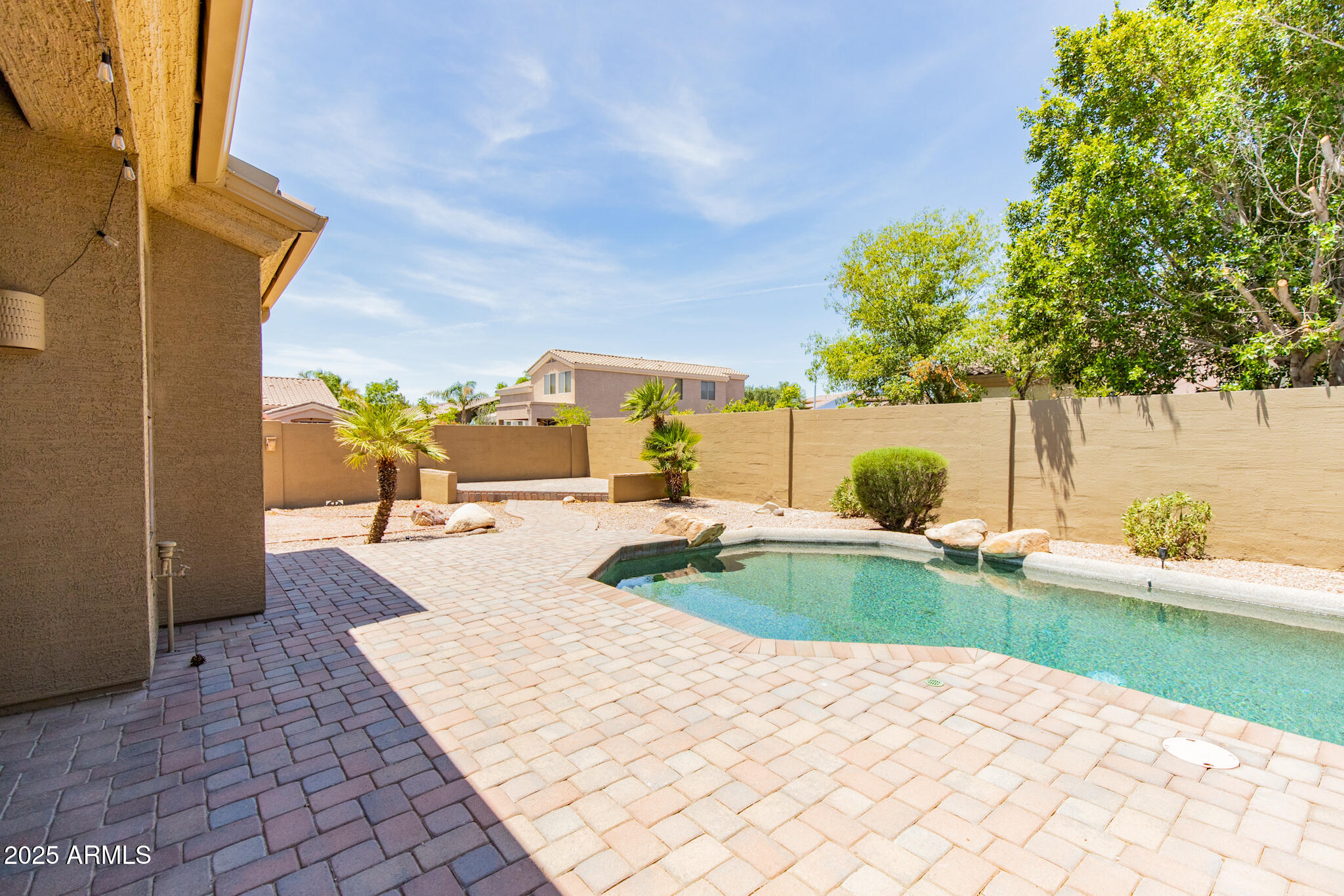 770 West Aloe Place Chandler, AZ 85248 - Photo 26 of 28 a view of a swimming pool with a patio