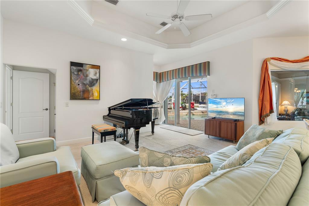 2736 Mayaguana Court Punta Gorda, FL 33950 - Photo 27 of 80 a living room with furniture and a dining table