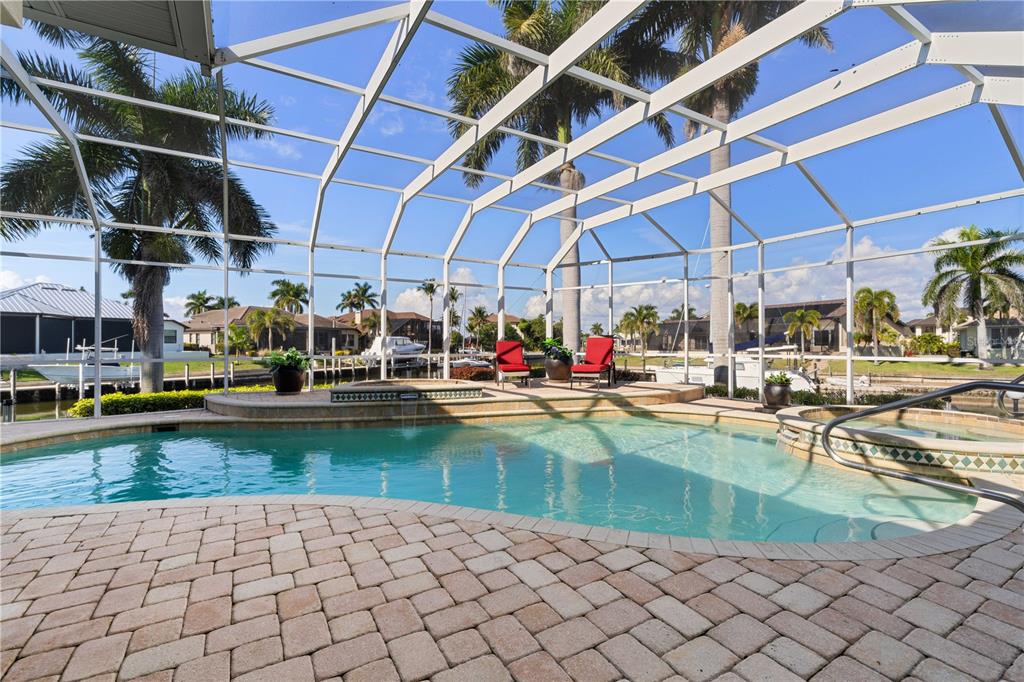 2736 Mayaguana Court Punta Gorda, FL 33950 - Photo 6 of 80 a view of a swimming pool with a outdoor seating