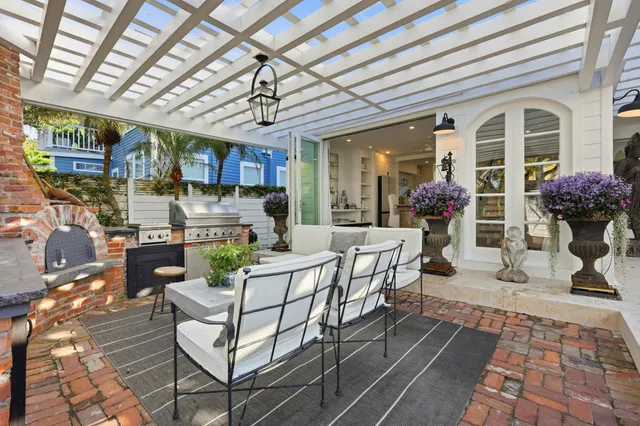 a view of a deck with chairs and wooden floor