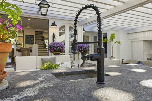 a view of a balcony with furniture