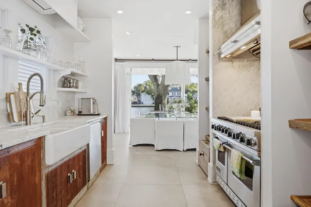 a kitchen with cabinets a sink and a stove