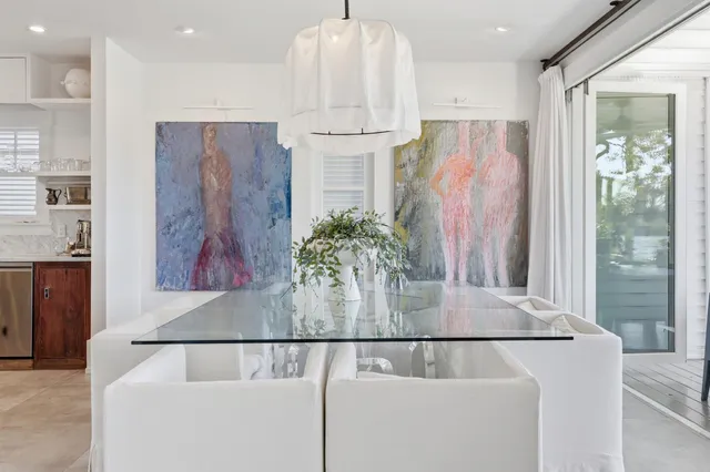 a bedroom with a bed and glass door