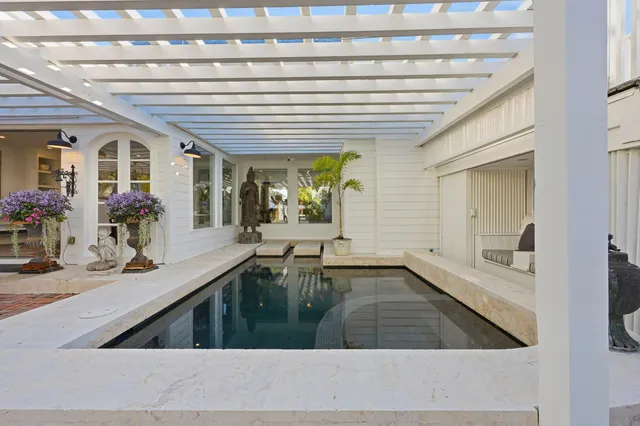 a view of a park with iron fence