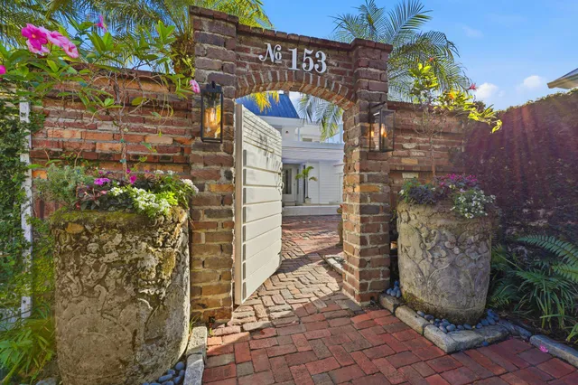 a outdoor space with patio the couches and dining table with garden view