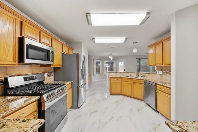 a bathroom with a sink a mirror and a toilet