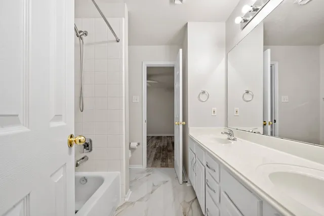a view of a room with wooden floor and windows