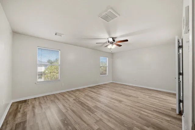 a view of an empty room with a window