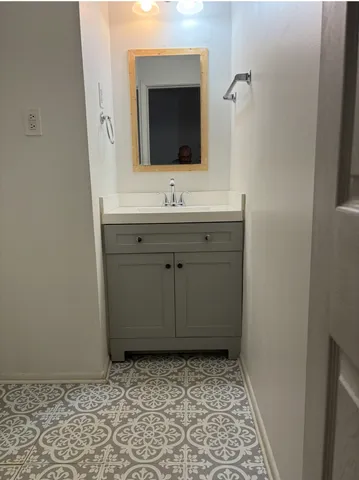 a kitchen with stainless steel appliances granite countertop a sink stove and refrigerator with cabinets