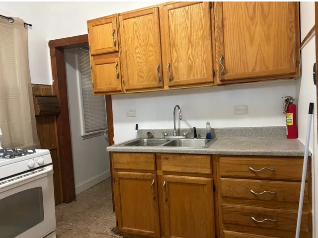 a view of a kitchen with washer and dryer