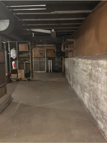 an empty room with wooden floor and closet