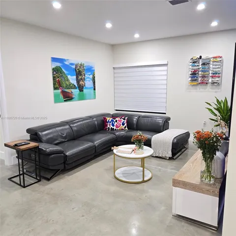 a living room with furniture and a couch