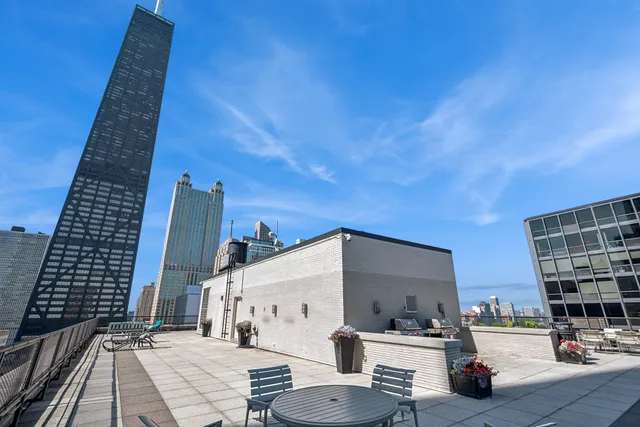 a view of a balcony with outdoor seating