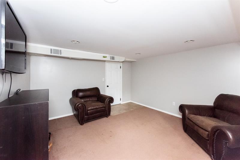 10089 Grubbs Road Wexford, PA 15090 - Photo 21 of 25 Bonus finished room in basement. The door leads to the 1 car garage. Use this room as an office, game room, media room, etc.