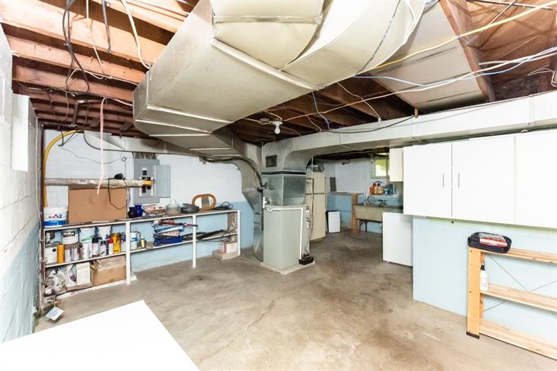 10089 Grubbs Road Wexford, PA 15090 - Photo 22 of 25 The unfinished area of basement. Laundry is to the back and right.