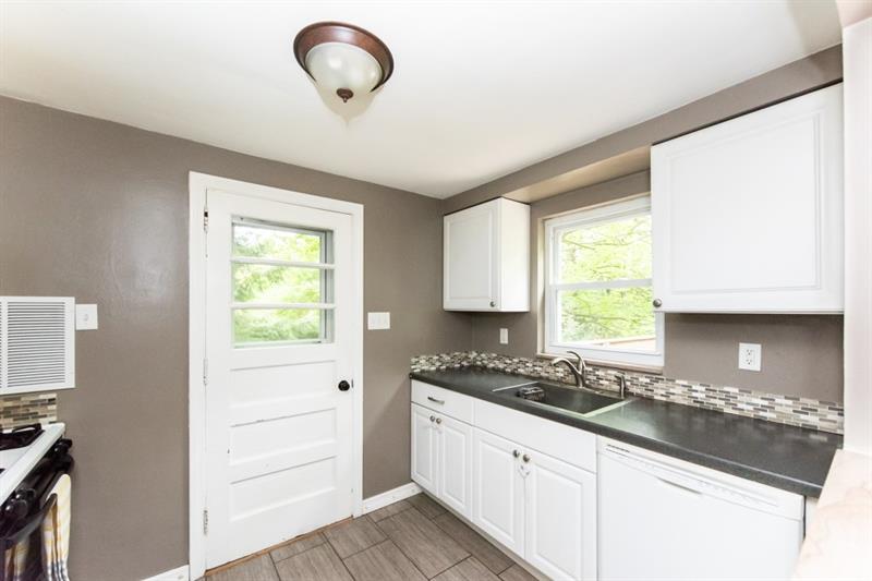 10089 Grubbs Road Wexford, PA 15090 - Photo 9 of 25 Sink, countertop and dishwasher area of kitchen.