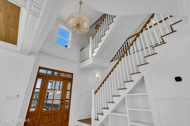 a view of a sink and dishwasher with wooden floor