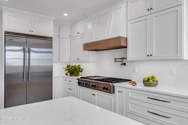 a bathroom with double vanity sink and a mirror