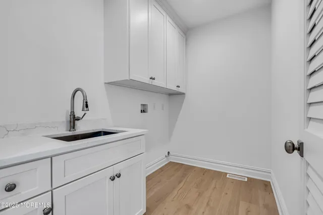 a view of a balcony with a floor to ceiling window and wooden fence