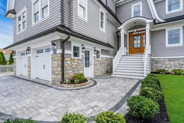 a view of a house with potted plants