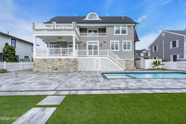 a view of a balcony with wooden floor