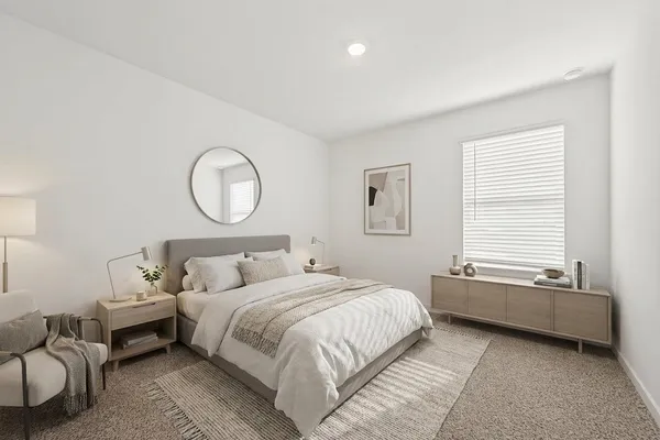 a bedroom with bed and a window