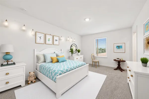 a bedroom with a bed and dresser