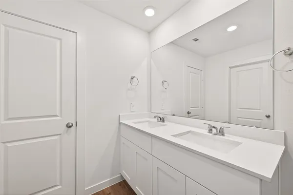 a white bath tub sitting next to a white toilet