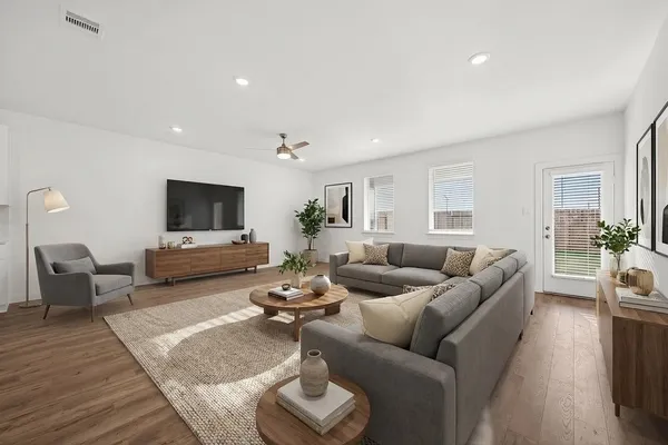 a living room with furniture and a flat screen tv
