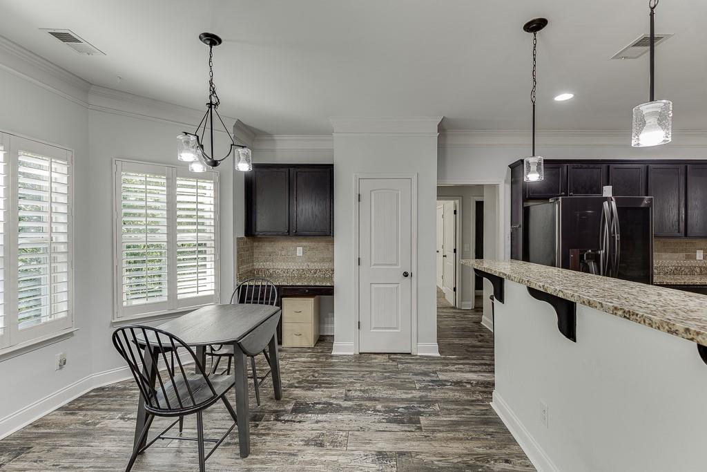 2858 Shadowstone Way Winder, GA 30680 - Photo 13 of 52 a view of a room with furniture and windows