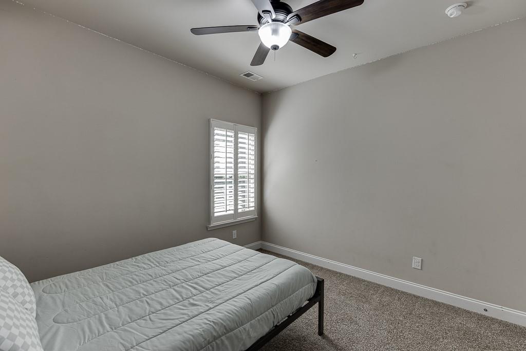 2858 Shadowstone Way Winder, GA 30680 - Photo 22 of 52 a bedroom with a bed and a window