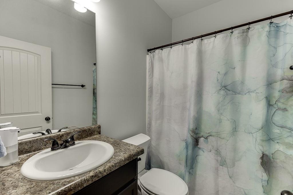 2858 Shadowstone Way Winder, GA 30680 - Photo 25 of 52 a bathroom with a sink and a mirror