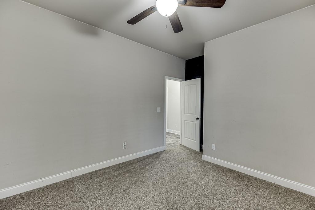 2858 Shadowstone Way Winder, GA 30680 - Photo 27 of 52 an empty room with a ceiling fan