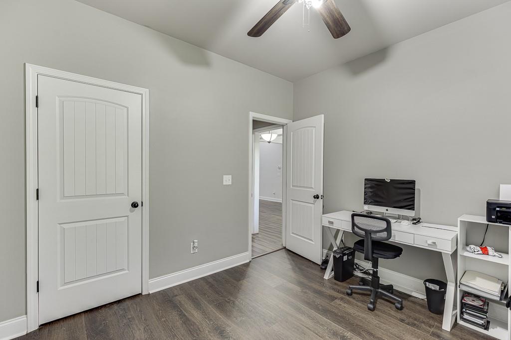 2858 Shadowstone Way Winder, GA 30680 - Photo 30 of 52 a view of a workspace with furniture and a ceiling fan